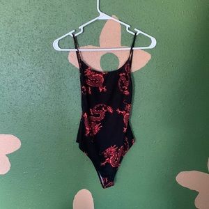 Black and red dragon body suit